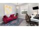 Office features a sofa, desk and a window allowing natural light, creating a functional and inviting workspace for productivity at 10580 Greycliffe Dr, Highlands Ranch, CO 80126