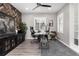 Inviting office space featuring a modern desk, herringbone accent wall, and ample natural light at 10580 Greycliffe Dr, Highlands Ranch, CO 80126