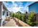 Backyard view showcasing well-maintained landscaping with a wooden fence and greenery at 21743 Farmingdale Ct, Parker, CO 80138