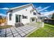 Backyard with a decorative tile patio, privacy fence, and mature landscaping at 21743 Farmingdale Ct, Parker, CO 80138