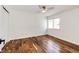 Bright bedroom with a neutral color scheme, wood floors, and a ceiling fan at 21743 Farmingdale Ct, Parker, CO 80138