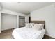 Comfortable bedroom with a large bed, plush pillows and carpet flooring at 21743 Farmingdale Ct, Parker, CO 80138