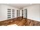 Bright bedroom with hardwood floors, decorative closet doors and ample natural light at 21743 Farmingdale Ct, Parker, CO 80138