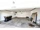 Spacious garage with overhead lighting, ample room for storage, and an automatic door at 21743 Farmingdale Ct, Parker, CO 80138