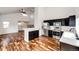 Modern kitchen featuring stainless steel appliances, black cabinets, white countertops and hardwood floors at 21743 Farmingdale Ct, Parker, CO 80138