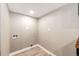 Bright laundry room with white walls, wood-look flooring and utility connections at 21743 Farmingdale Ct, Parker, CO 80138
