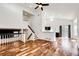 Open-concept living room with high ceilings, hardwood floors, and plenty of natural light at 21743 Farmingdale Ct, Parker, CO 80138