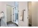 View of walk in shower and toilet room with dark tile floor and white trim at 10163 W 38Th Ave, Wheat Ridge, CO 80033