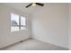Bedroom with natural light from a large window, light carpet, and neutral paint at 10163 W 38Th Ave, Wheat Ridge, CO 80033