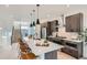 Modern kitchen boasts a large island, stainless steel appliances, and sleek wood cabinetry at 10163 W 38Th Ave, Wheat Ridge, CO 80033