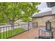 Inviting balcony with wood floors, metal railings, seating and neighborhood views at 8657 Aberdeen Cir, Highlands Ranch, CO 80130