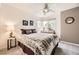 Bright bedroom with a ceiling fan, large windows, and warm decor creates a peaceful atmosphere at 8657 Aberdeen Cir, Highlands Ranch, CO 80130