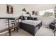 A bedroom with functional storage solutions under the bed. Comfort and convenience combined at 8657 Aberdeen Cir, Highlands Ranch, CO 80130