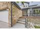 Charming home featuring stone accents, three-car garage, and inviting front entrance at 8657 Aberdeen Cir, Highlands Ranch, CO 80130
