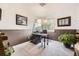 Functional home office with a dark work desk and bright natural light creates an ideal workspace at 8657 Aberdeen Cir, Highlands Ranch, CO 80130