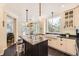 Open kitchen with a large island, farmhouse sink, stainless appliances, and pendant lighting at 8657 Aberdeen Cir, Highlands Ranch, CO 80130