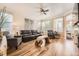 Comfortable living room with hardwood floors, stylish furniture, and bright natural light at 8657 Aberdeen Cir, Highlands Ranch, CO 80130