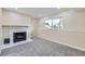 Finished basement offers a fireplace and a window for natural light, creating a welcoming atmosphere at 1880 E 81St Pl, Denver, CO 80229
