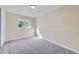 Neutral bedroom with a window, gray carpeting, and a large closet at 1880 E 81St Pl, Denver, CO 80229