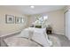 Serene bedroom with neutral colors, soft carpet, and large window for ample natural light at 1880 E 81St Pl, Denver, CO 80229