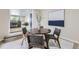 Cozy dining area featuring contemporary furnishings and an open view of the updated kitchen at 1880 E 81St Pl, Denver, CO 80229