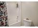 Bathroom featuring a tub and shower combination, complemented by playful decor at 760 N Allium St, Watkins, CO 80137