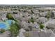 Wide aerial view of the neighborhood showcasing tennis courts, lush greenery, and easy access to urban amenities at 5875 W Asbury Pl, Lakewood, CO 80227