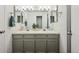 Bathroom featuring a double sink vanity with modern fixtures and ample counter space at 5875 W Asbury Pl, Lakewood, CO 80227