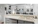 Kitchen view to the living room and dining area has white countertops and stainless steel appliances at 5875 W Asbury Pl, Lakewood, CO 80227