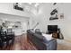 Bright, open-concept living room with high ceilings and seamless flow to the kitchen at 5875 W Asbury Pl, Lakewood, CO 80227