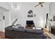 Spacious living room featuring vaulted ceilings, fan and comfortable furniture at 5875 W Asbury Pl, Lakewood, CO 80227