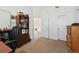 Office featuring neutral walls, built-in shelving, and an ensuite bathroom at 5875 W Asbury Pl, Lakewood, CO 80227