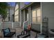 Inviting patio with stylish outdoor furniture, providing a cozy space for relaxation and entertaining at 5875 W Asbury Pl, Lakewood, CO 80227