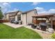 Backyard with outdoor seating, built in hot tub, patio, and well-maintained lawn at 11511 E 118Th Ave, Commerce City, CO 80640