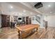 Finished basement featuring a pool table, bar area, and wine storage at 11511 E 118Th Ave, Commerce City, CO 80640