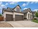 Charming two-story home with three-car garage and beautifully landscaped front yard at 11511 E 118Th Ave, Commerce City, CO 80640