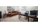Inviting home office featuring a comfortable couch, desk setup, and ample natural light at 11511 E 118Th Ave, Commerce City, CO 80640