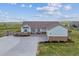Attractive single-Gathering home with stone accents, three-car garage, long driveway, and fenced yard at 527 Antelope E Dr, Bennett, CO 80102