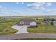 Beautiful home with a large driveway, well-manicured lawn, and lovely landscaping on a sunny day at 527 Antelope E Dr, Bennett, CO 80102