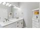 Elegant bathroom features a double vanity with white cabinets and storage at 527 Antelope E Dr, Bennett, CO 80102