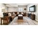 Inviting living room featuring a large sectional sofa and rustic wood accents at 527 Antelope E Dr, Bennett, CO 80102