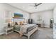 Comfortable bedroom with a stylish bed, lamps, secure safe, and work desk at 527 Antelope E Dr, Bennett, CO 80102