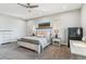 Comfortable bedroom with a stylish bed, lamps, and secure safe at 527 Antelope E Dr, Bennett, CO 80102