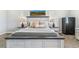 Comfortable bedroom with a stylish bed, lamps, and secure safe at 527 Antelope E Dr, Bennett, CO 80102