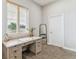 The office features a wooden desk and window with blinds at 527 Antelope E Dr, Bennett, CO 80102