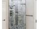 Beautiful walk-in shower featuring marble tile and modern fixtures at 527 Antelope E Dr, Bennett, CO 80102
