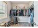 Spacious walk-in closet with ample hanging and shelving space for organization at 527 Antelope E Dr, Bennett, CO 80102