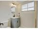 Cozy bathroom with modern fixtures, vanity and sink, and bright lighting at 11310 W Center Ave, Lakewood, CO 80226