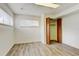 Bedroom with hardwood floors, large windows for natural light, and spacious closet at 11310 W Center Ave, Lakewood, CO 80226