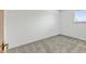 Standard bedroom with neutral carpet and natural light from the window at 11310 W Center Ave, Lakewood, CO 80226